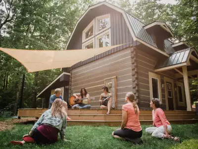 Ontario wellness retreats | Group sitting on deck at Northern Edge Algonquin Ontario wellness retreat