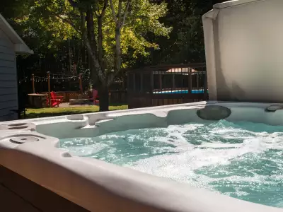 Ontario wellness retreats | Hot tub and hammock on lawn at Pure Lotus wellness retreat in Ontario