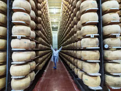 Katie Bridges inside Parmigiano Reggiano Caseificio in Parma, Italy