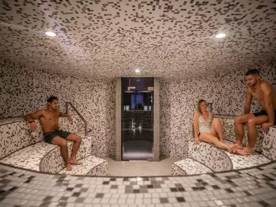 Quebec spa | Three people in a sauna at Scandinave Spa Mont-Tremblant