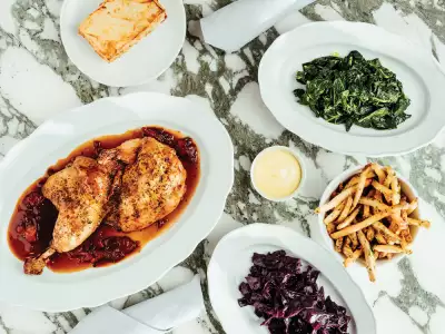 Half roasted chicken with sides at The Royal Hotel in Picton