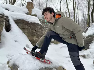 Escapism's Hunter Gutman adjusting his snowshoes in his Columbia Landroamer Collection