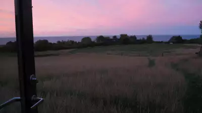 Sunset from the cabin at Bornholm Surf Farm