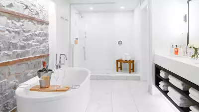 Ontario's best boutique hotels | Exposed limestone bathroom at The Frontenac Club in Kingston