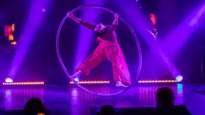 Cirque Éloize | A Cyr Wheel acrobat performs in Celeste