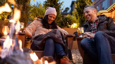 Hotel Zed Tofino | A couple laugh around the patio at Roar