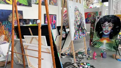 A collection of easels with beautiful art on them in the Cayman Islands