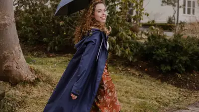Someone wearing the Midnight Blue Mernini raincoat