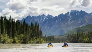 Canoe through canyons on the South Nahanni River Canoe through canyons on the South Nahanni River
