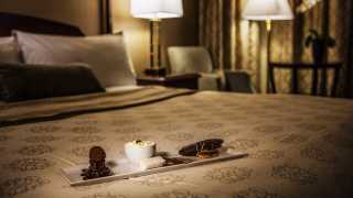 Restaurants in Victoria, B.C. plus hotels, activities and more | Sweet treats on a bed at the Magnolia Hotel & Spa
