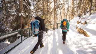 Best things to do in Banff right now | Hikers in Johnston Canyon