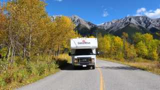 CanaDream: RV rentals in Ontario | A CanaDream Maxi Travel Camper driving through a mountainous area