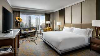 The Ritz-Carlton Hotel Toronto | Bedroom suite overlooking downtown Toronto