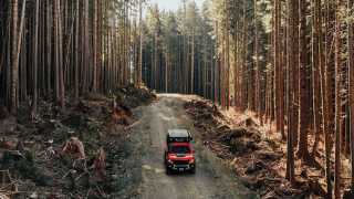 Gears of Travel, Canadian adventure | Chevrolet with canopy camper in forest