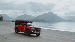 Gears of Travel, Canadian adventure | Chevrolet with canopy camper on beach