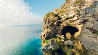 Breathtaking Ontario beaches | The Grotto is a cave with a pool of blue water inside