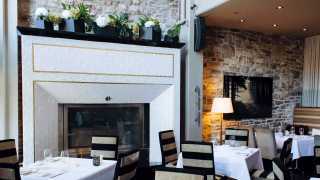 The best things to eat and do in Ottawa | Dining room fireplace at Restaurant e18hteen