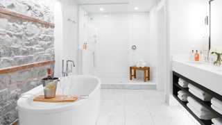 Ontario's best boutique hotels | Exposed limestone bathroom at The Frontenac Club in Kingston