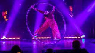 Cirque Éloize | A Cyr Wheel acrobat performs in Celeste
