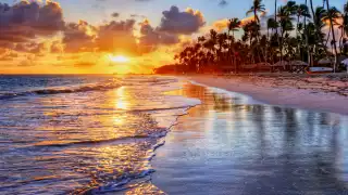 The best Caribbean islands to visit | The sun sets over a tropical beach