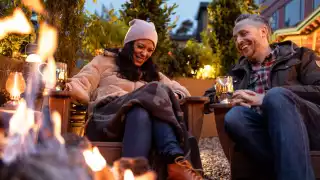 Hotel Zed Tofino | A couple laugh around the patio at Roar