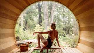 Hotel Zed Tofino | A woman lounges in the barrel sauna