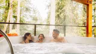 Hotel Zed Tofino | A family enjoy the rainforest hot tub