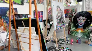 A collection of easels with beautiful art on them in the Cayman Islands