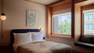 New Toronto hotels | A bedroom inside the Ace Hotel Toronto