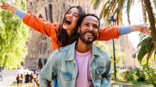 Outdoor Adventure Show, Toronto | A man piggy-backing a woman in a tropical setting