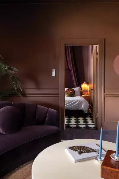 Hotel Julie in Stratford | A peek into the bedroom from the living room in Flat 3 at Hotel Julie