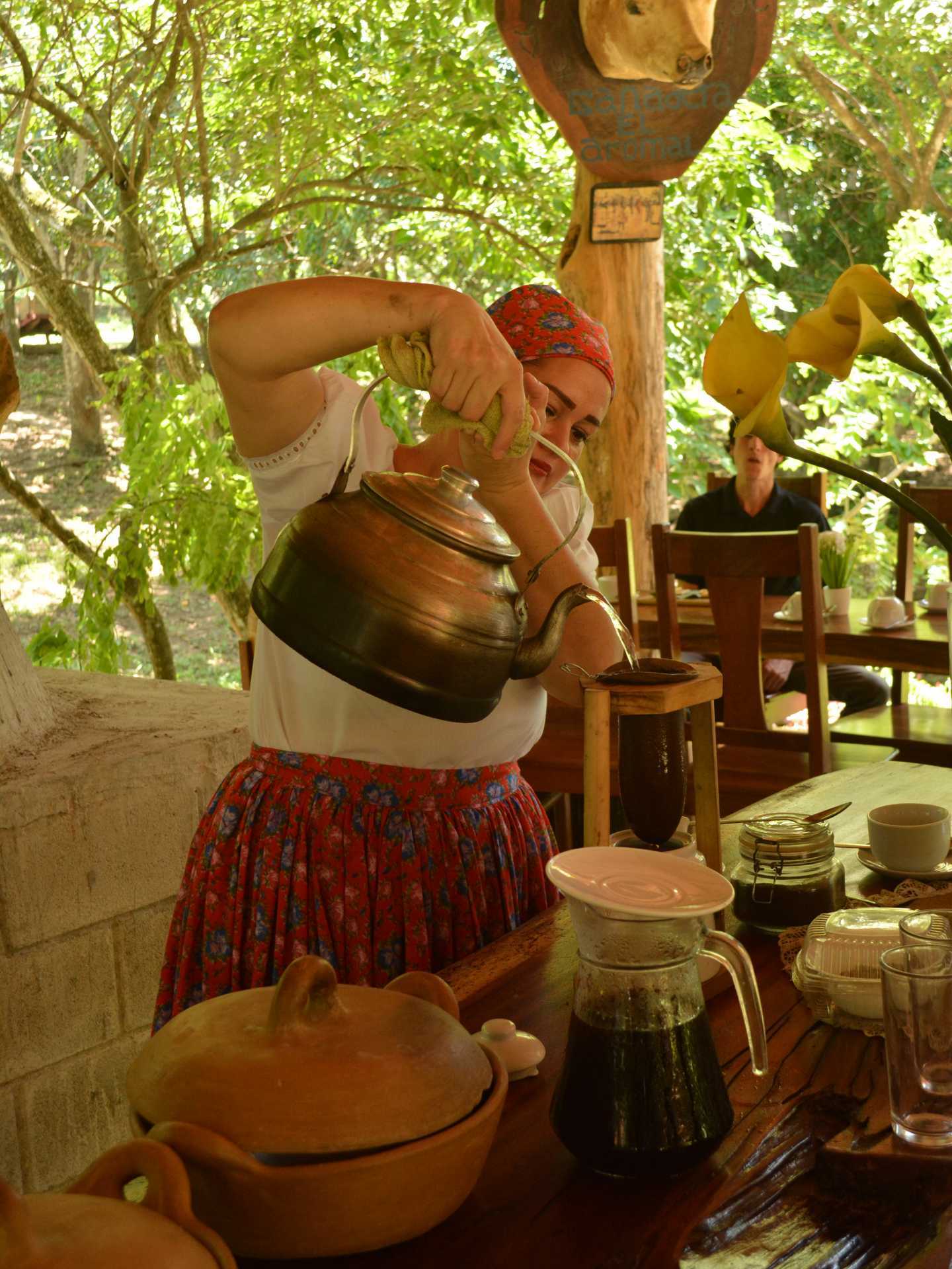 Hacienda Aromal cultural experience in the Papagayo Peninsula, Costa Rica | A lady pours from a kettle