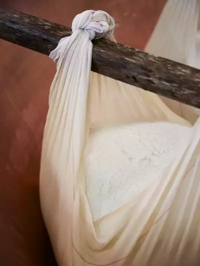 A swaddled ball of Parmigiano Reggiano