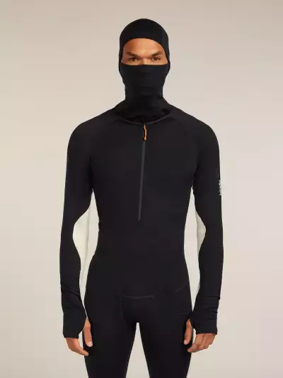 A man wearing the icebreaker Merino 200 Oasis+ Thermal Suit with hood and mask