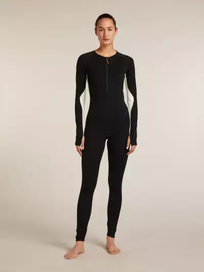 A woman wearing the icebreaker Merino 200 Oasis+ Thermal Suit
