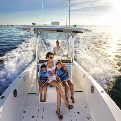 A woman and her two children on a boat in the Florida Keys