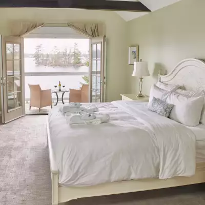 The bedroom and balcony at a Rawley Resort room