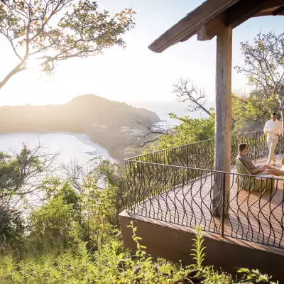 Two people sitting on a deck in Costa Rica
