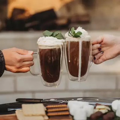 Travel gift ideas | Drinks and s'mores in front of the fireplace at The Beach Motel