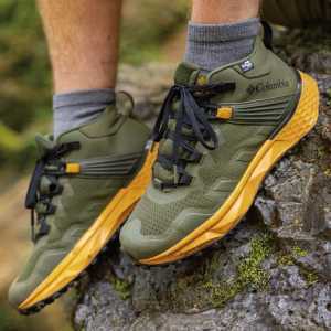 Columbia hiking shoes | Green hiking shoes on a log outside in the forest