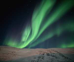 Nunavik | The bright green and sometimes purple ribbons of the aurora borealis (Northern Lights)