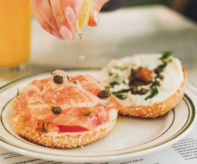 Montreal bagels | A bagel topped with cream cheese and salmon lox