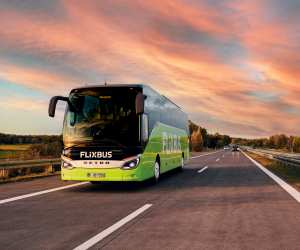 A Flixbus driving at sunset