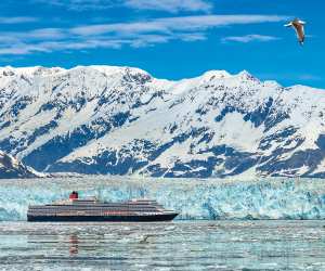 Cunard Cruises | The Cunard Queen Elizabeth travels next to a glacier in Alaska