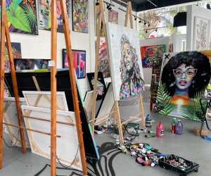 A collection of easels with beautiful art on them in the Cayman Islands