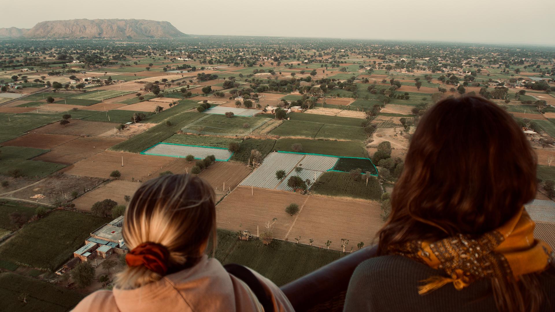 Tourism industry recovery | Two women look out over a landscape