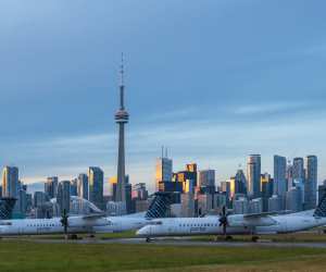 Airplanes at Billy Bishop Toronto City Airport with the city skyline as the backdrop