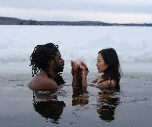 A couple takes a cold plunge at Dimensions Algonquin Highlands