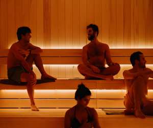 Alter cold plunge and sauna in Toronto |  A group of people sitting in the sauna at Alter
