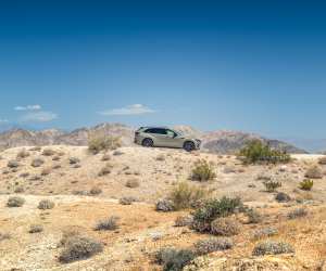 A Mazda CX-70 driving in the desert in Palm Springs, California